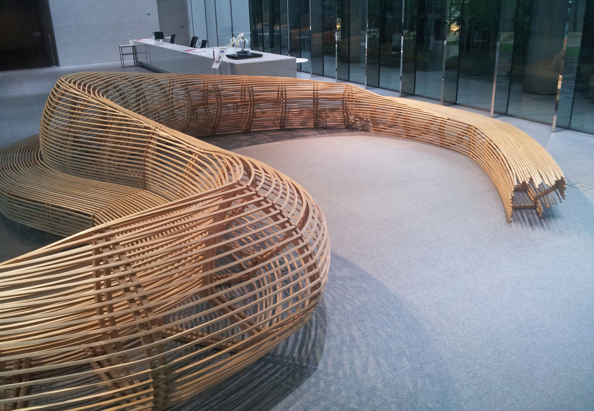 A huge bamboo dragon curls around to make a seating area in the lobby of the TK Minami Aoyama Bldg., June 24, 2014